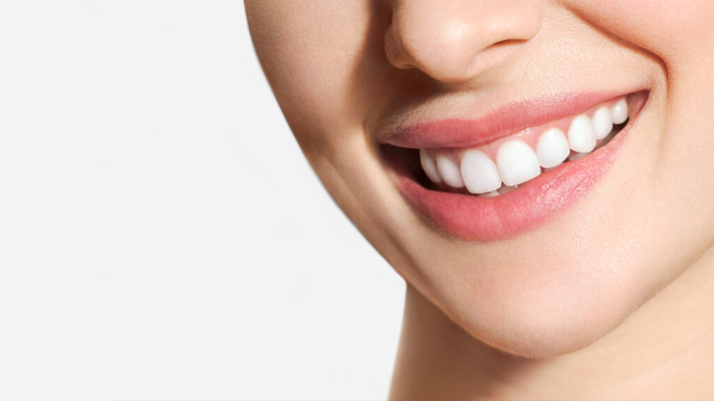 perfect healthy teeth smile of a young woman. teeth whitening. dental clinic patient. image symbolizes oral care dentistry, stomatology