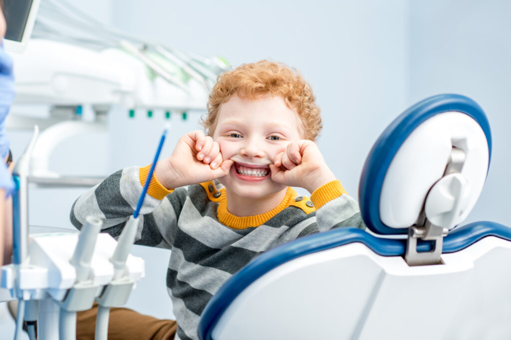 portrait of a smiling boy at the dental office